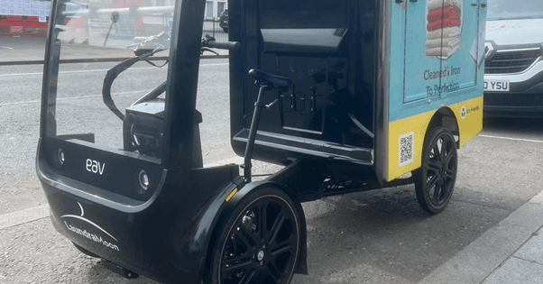 Delivery E Bike for delivery and pickup of laundry items. The Eco friendly solution